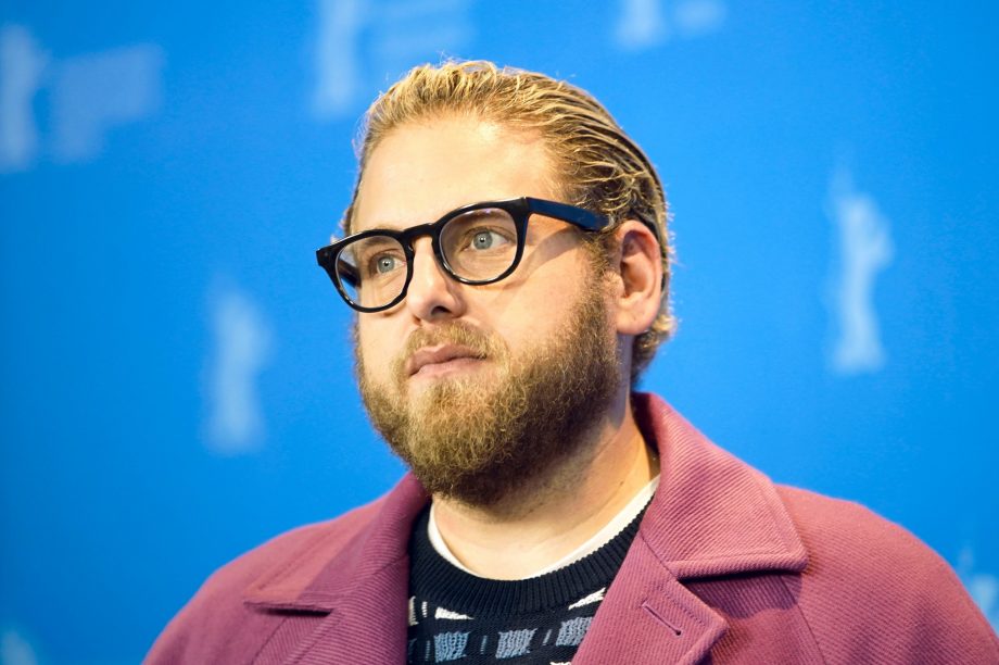 Jonah Hill with a slicked back men's haircut. 